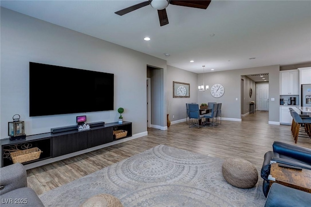 379 Mano Destra Ln, Henderson, NV 89011 - living room with light wood finished floors, ceiling fan, recessed lighting, and baseboards