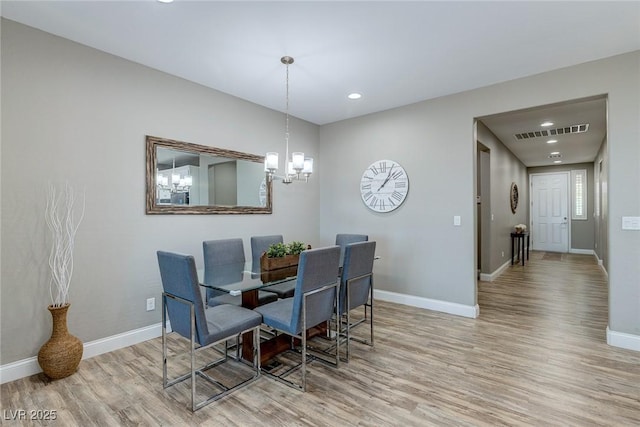 379 Mano Destra Ln, Henderson, NV 89011 - dining area with wood finished floors, baseboards, a chandelier, and recessed lighting