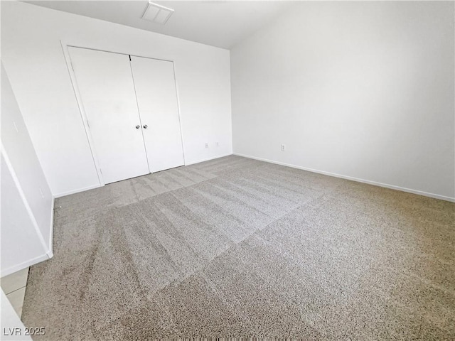 2125 Stone Well Rd, North Las Vegas, NV 89031 - unfurnished bedroom with a closet, baseboards, and carpet
