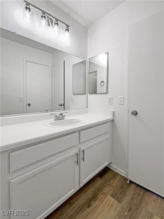 2125 Stone Well Rd, North Las Vegas, NV 89031 - bathroom featuring vanity and wood finished floors