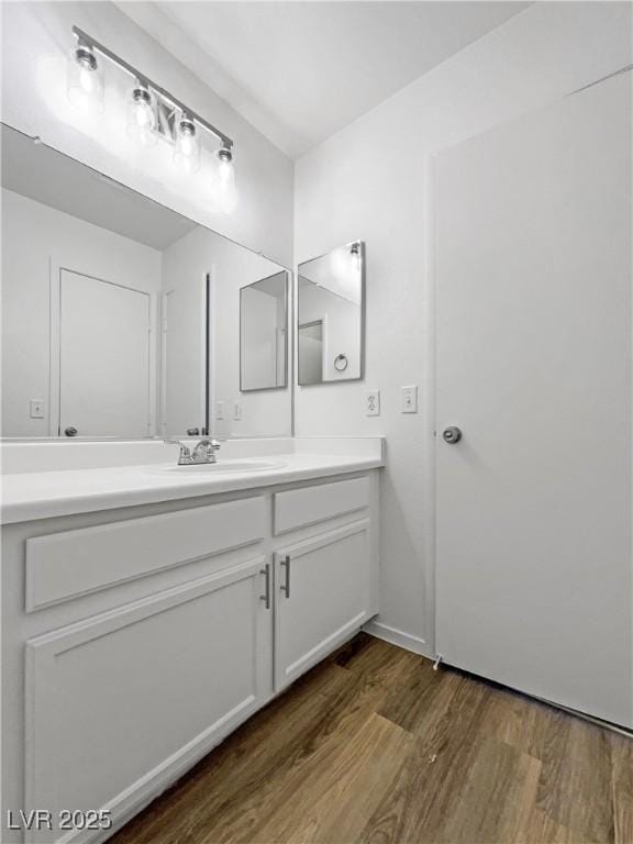 2125 Stone Well Rd, North Las Vegas, NV 89031 - bathroom with vanity and wood finished floors