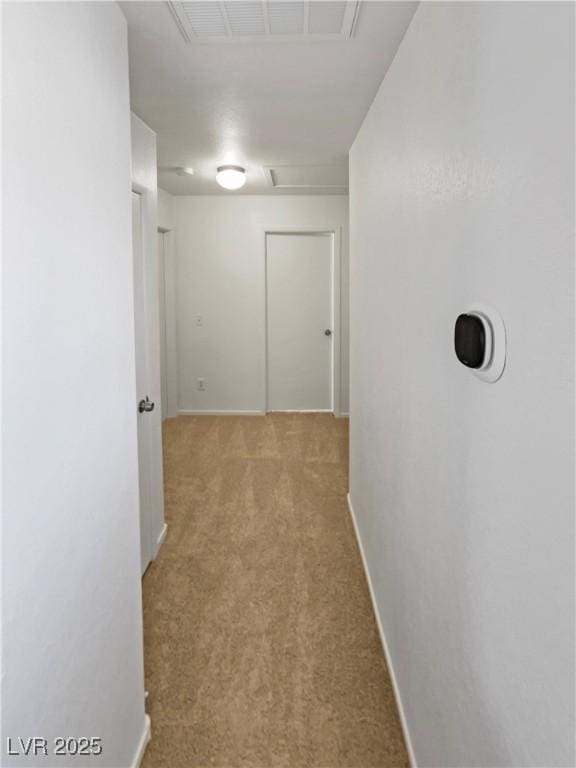 2125 Stone Well Rd, North Las Vegas, NV 89031 - hallway with carpet, attic access, and baseboards