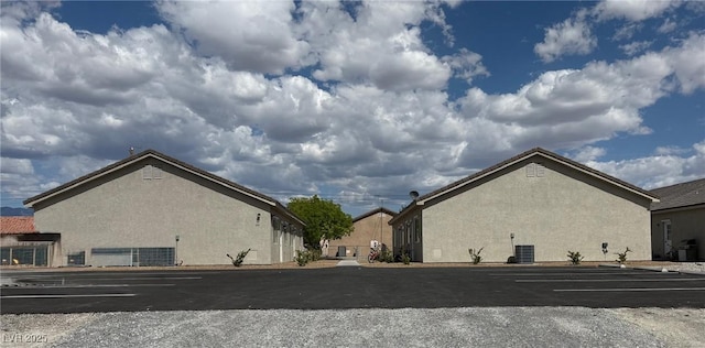 1121 Sixshooter Ave, Pahrump, NV 89048 - view of property with uncovered parking and central AC unit