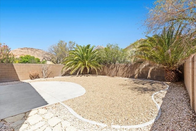 180 Duck Hollow Ave, Las Vegas, NV 89148 - fenced backyard featuring a patio and a mountain view