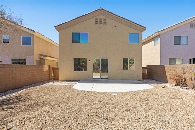 180 Duck Hollow Ave, Las Vegas, NV 89148 - rear view of property featuring a fenced backyard, stucco siding, and a patio