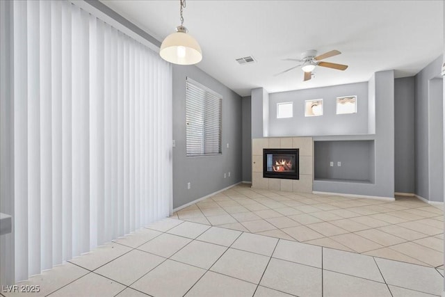 180 Duck Hollow Ave, Las Vegas, NV 89148 - unfurnished living room with ceiling fan, a fireplace, tile patterned flooring, baseboards, and built in features
