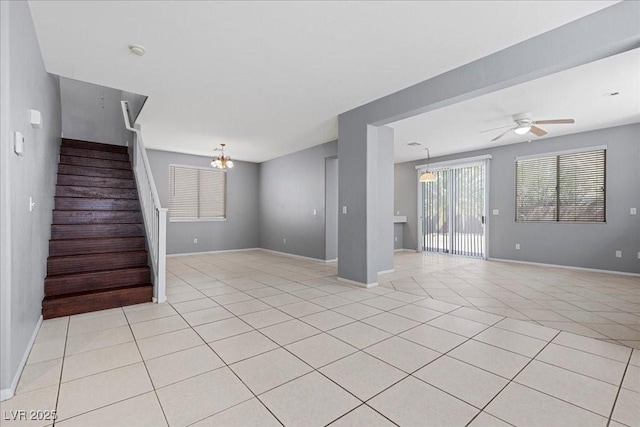 180 Duck Hollow Ave, Las Vegas, NV 89148 - unfurnished living room with stairs, light tile patterned flooring, baseboards, and a chandelier