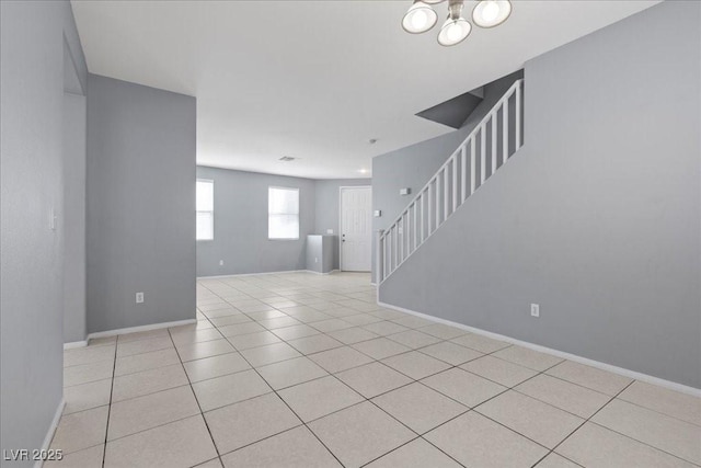 180 Duck Hollow Ave, Las Vegas, NV 89148 - spare room featuring stairs, tile patterned flooring, and baseboards