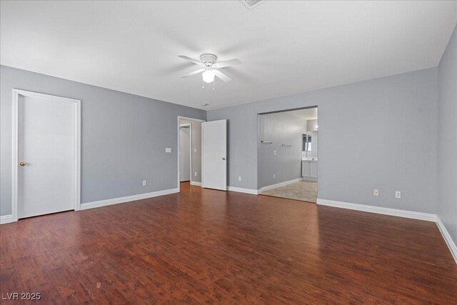 180 Duck Hollow Ave, Las Vegas, NV 89148 - unfurnished room with ceiling fan, baseboards, and wood finished floors