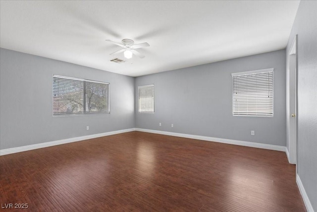 180 Duck Hollow Ave, Las Vegas, NV 89148 - spare room featuring ceiling fan, dark wood-type flooring, and baseboards