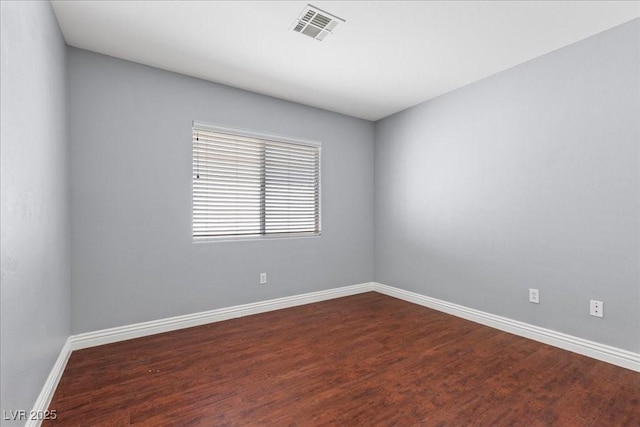 180 Duck Hollow Ave, Las Vegas, NV 89148 - empty room with baseboards and dark wood-type flooring
