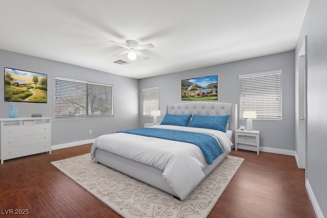 180 Duck Hollow Ave, Las Vegas, NV 89148 - bedroom with baseboards, dark wood-style flooring, and a ceiling fan