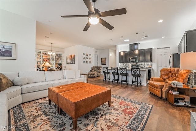 715 Orange Plume Walk, Henderson, NV 89011 - living room with wood finished floors, ceiling fan, recessed lighting, and a chandelier