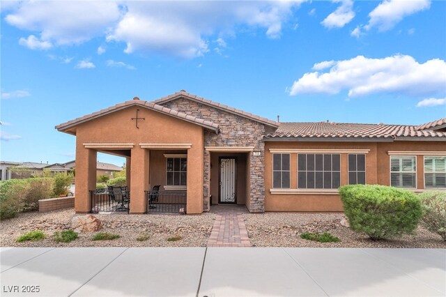 715 Orange Plume Walk, Henderson, NV 89011 - ranch-style house featuring stucco siding, a tile roof, and a patio