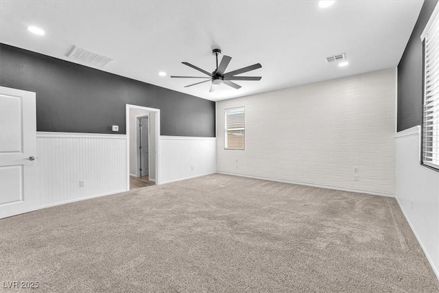 4510 Rubious Ave, North Las Vegas, NV 89084 - carpeted empty room with a ceiling fan, wainscoting, and recessed lighting