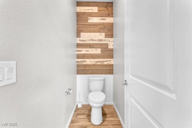 4510 Rubious Ave, North Las Vegas, NV 89084 - bathroom with wood finished floors, toilet, and baseboards