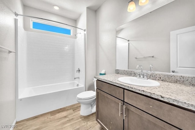 4510 Rubious Ave, North Las Vegas, NV 89084 - full bathroom featuring bathing tub / shower combination, wood finished floors, vanity, and toilet