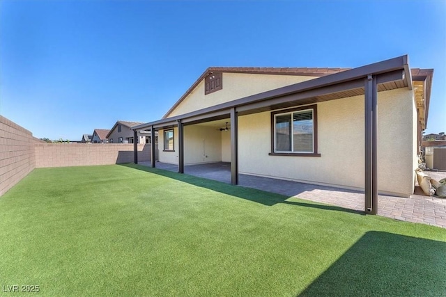 4510 Rubious Ave, North Las Vegas, NV 89084 - rear view of house with stucco siding and a patio