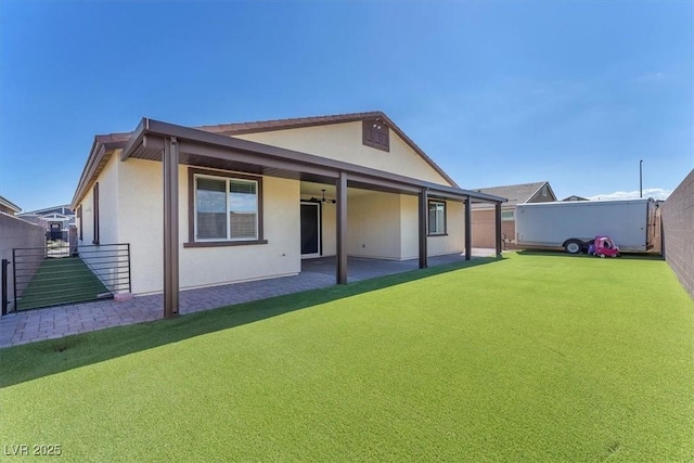 4510 Rubious Ave, North Las Vegas, NV 89084 - rear view of property featuring a patio area, a fenced backyard, and stucco siding