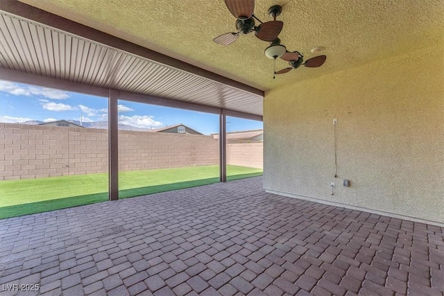 4510 Rubious Ave, North Las Vegas, NV 89084 - fenced backyard with ceiling fan and a patio area
