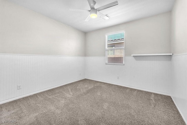 4510 Rubious Ave, North Las Vegas, NV 89084 - unfurnished room featuring wainscoting, carpet floors, and a ceiling fan