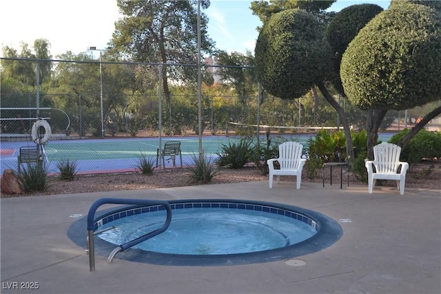 725 N Royal Crest Cir Unit 228, Las Vegas, NV 89169 - view of swimming pool featuring a community hot tub and a tennis court