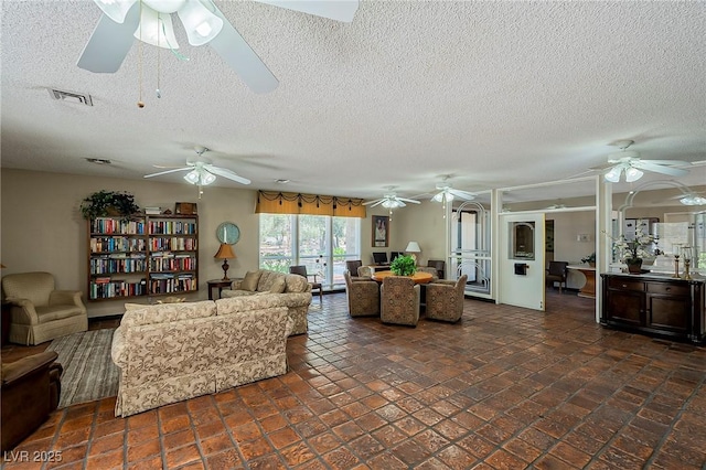 725 N Royal Crest Cir Unit 228, Las Vegas, NV 89169 - living area featuring ceiling fan and a textured ceiling