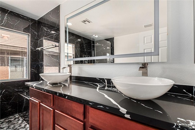 9173 Weeping Hollow Ave, Las Vegas, NV 89178 - full bathroom with double vanity and marble finish floors