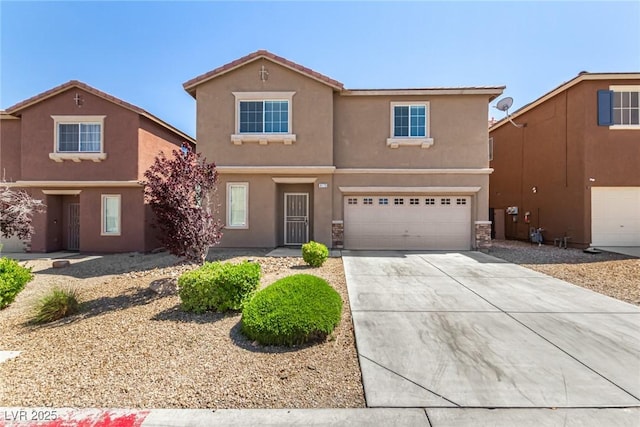 9173 Weeping Hollow Ave, Las Vegas, NV 89178 - view of front of home featuring stucco siding, concrete driveway, and a garage