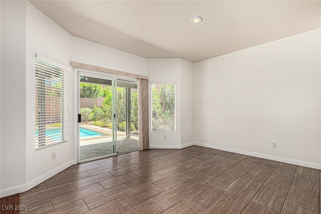 9173 Weeping Hollow Ave, Las Vegas, NV 89178 - spare room featuring baseboards, dark wood-style floors, and recessed lighting