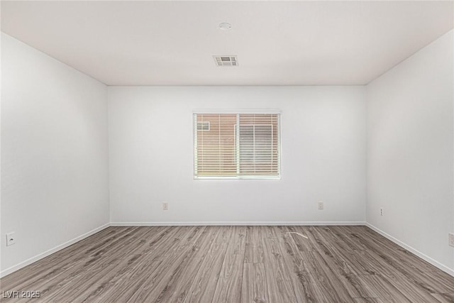 9173 Weeping Hollow Ave, Las Vegas, NV 89178 - spare room with wood finished floors and baseboards