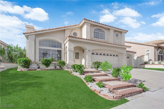 1611 Buffalo Trail Dr, Henderson, NV 89014 - mediterranean / spanish-style home featuring concrete driveway, a front yard, a garage, stucco siding, and a chimney