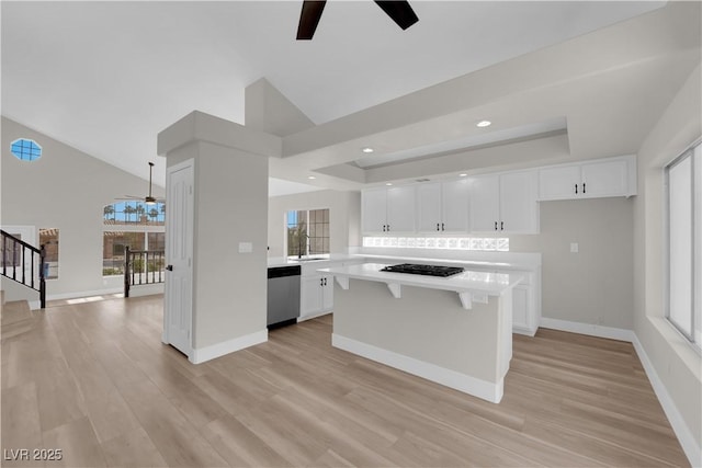 1611 Buffalo Trail Dr, Henderson, NV 89014 - kitchen with ceiling fan, light countertops, stainless steel dishwasher, white cabinets, and recessed lighting