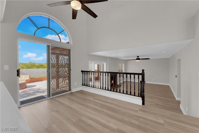 1611 Buffalo Trail Dr, Henderson, NV 89014 - entryway with a ceiling fan, plenty of natural light, light wood-style flooring, and a high ceiling