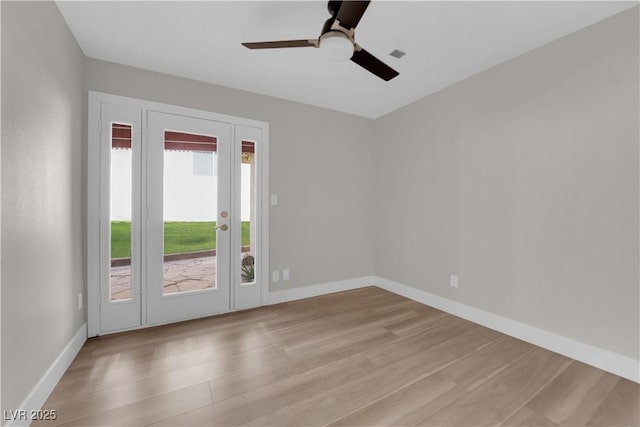 1611 Buffalo Trail Dr, Henderson, NV 89014 - empty room featuring wood finished floors, ceiling fan, french doors, and baseboards
