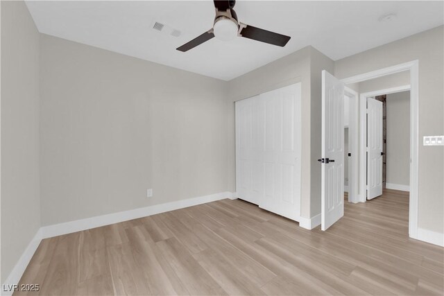 1611 Buffalo Trail Dr, Henderson, NV 89014 - unfurnished bedroom with light wood-type flooring, baseboards, a closet, and ceiling fan
