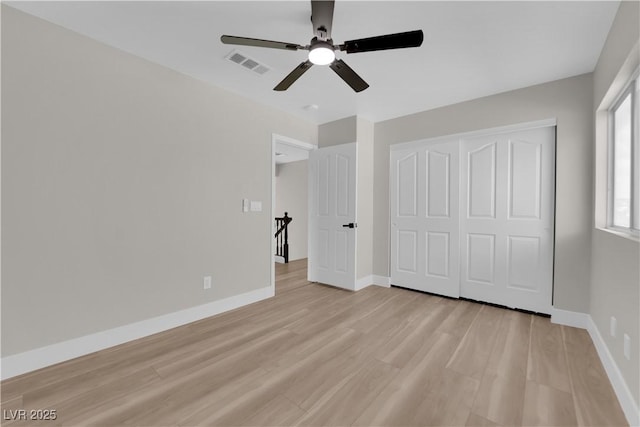 1611 Buffalo Trail Dr, Henderson, NV 89014 - unfurnished bedroom with light wood finished floors, baseboards, a closet, and a ceiling fan