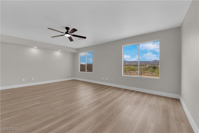 1611 Buffalo Trail Dr, Henderson, NV 89014 - unfurnished room with a ceiling fan, light wood-style floors, and baseboards