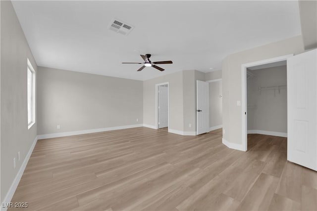 1611 Buffalo Trail Dr, Henderson, NV 89014 - unfurnished living room with a ceiling fan, baseboards, and light wood finished floors