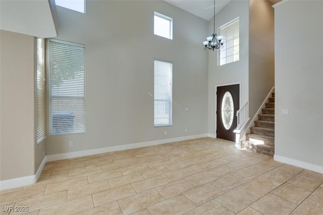 1917 Badger Canyon Ave, North Las Vegas, NV 89031 - foyer featuring a high ceiling, a chandelier, stairs, and baseboards