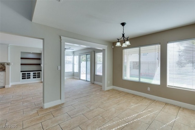 1917 Badger Canyon Ave, North Las Vegas, NV 89031 - unfurnished room featuring a chandelier, baseboards, and light tile patterned floors