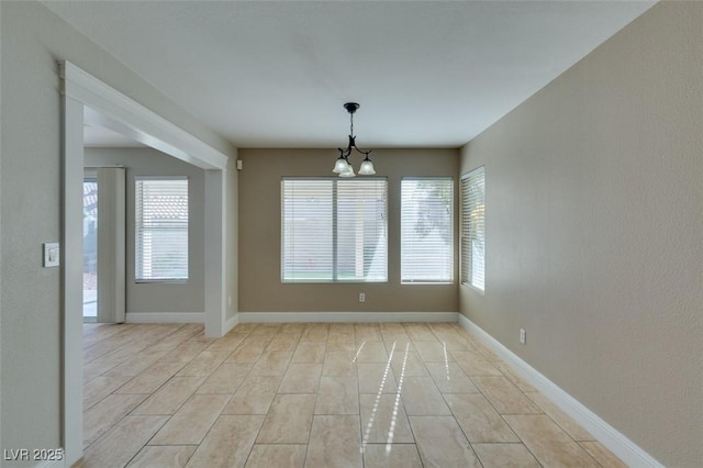 1917 Badger Canyon Ave, North Las Vegas, NV 89031 - unfurnished room with a chandelier and baseboards