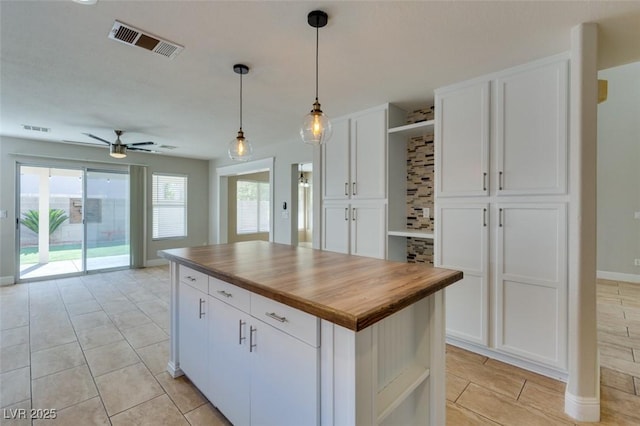 1917 Badger Canyon Ave, North Las Vegas, NV 89031 - kitchen with open shelves, wooden counters, white cabinets, and a ceiling fan