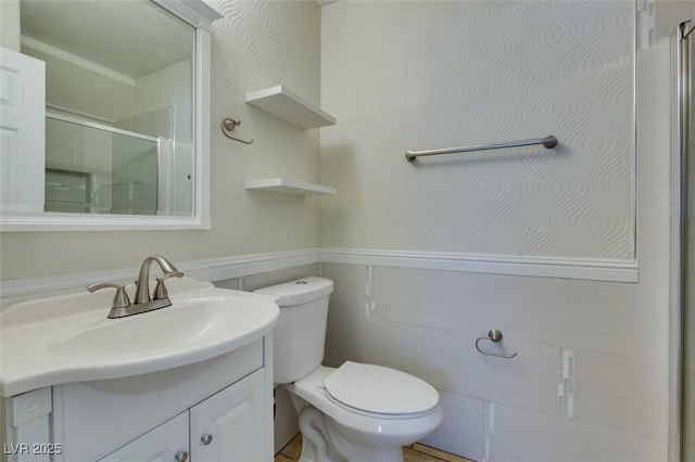 1917 Badger Canyon Ave, North Las Vegas, NV 89031 - bathroom with vanity, toilet, a shower with shower door, and wainscoting