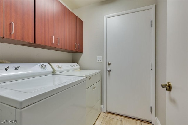 1917 Badger Canyon Ave, North Las Vegas, NV 89031 - laundry area with washing machine and clothes dryer, cabinet space, baseboards, and light tile patterned flooring