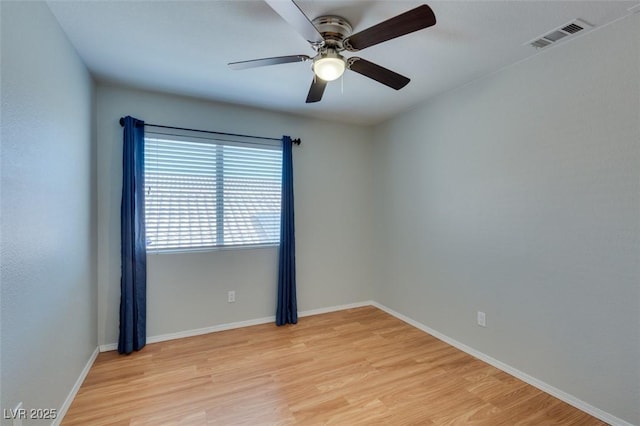 1917 Badger Canyon Ave, North Las Vegas, NV 89031 - spare room featuring light wood finished floors, ceiling fan, and baseboards
