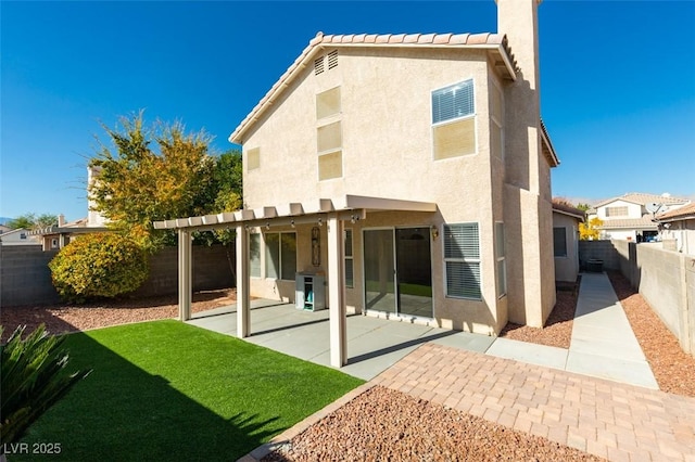 1917 Badger Canyon Ave, North Las Vegas, NV 89031 - rear view of property with stucco siding, a patio area, and a pergola