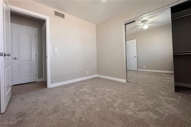 6929 Montcliff Ave, Las Vegas, NV 89147 - unfurnished bedroom with carpet, a closet, baseboards, and a textured ceiling