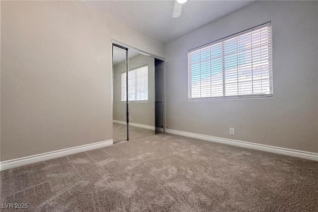 6929 Montcliff Ave, Las Vegas, NV 89147 - unfurnished bedroom with carpet flooring, a closet, baseboards, and ceiling fan