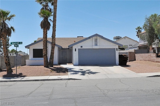 6929 Montcliff Ave, Las Vegas, NV 89147 - ranch-style home featuring stucco siding, an attached garage, and concrete driveway